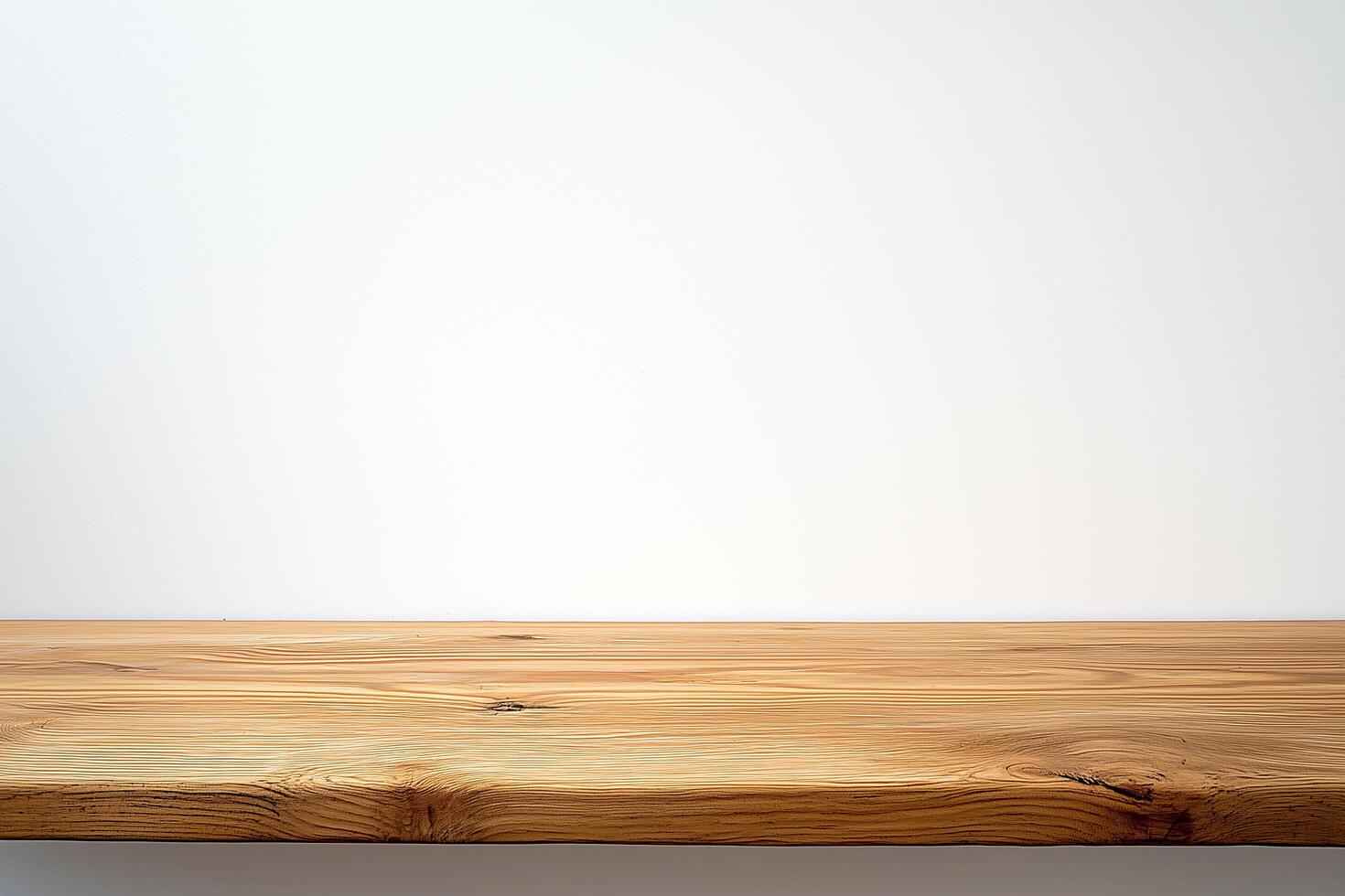 Empty wooden tabletop on white background providing copy space photo