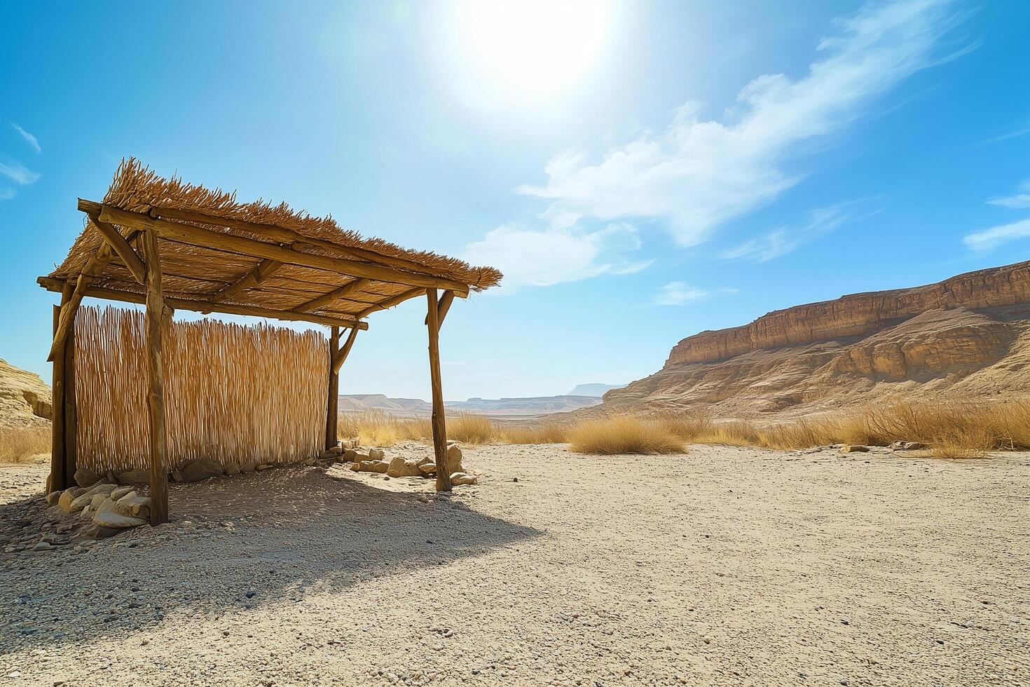 Simple sukkah standing in the desert on yom kippur photo