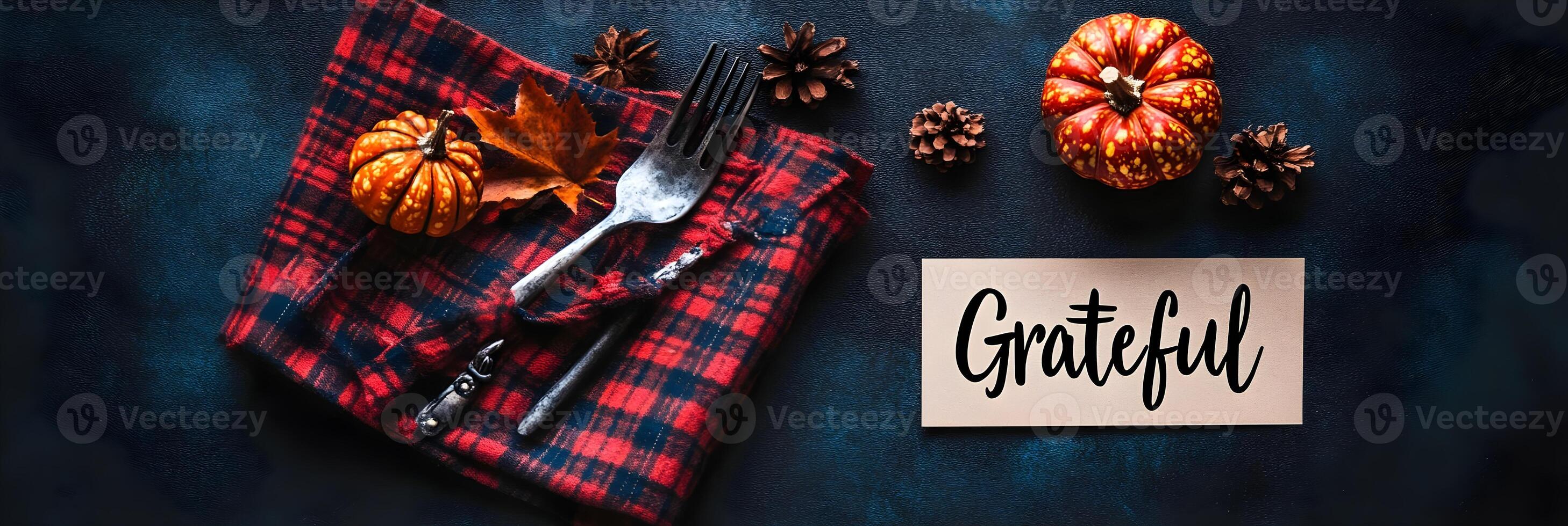 Thanksgiving Table Setting with Pumpkins Plaid Napkin and Grateful Sign photo