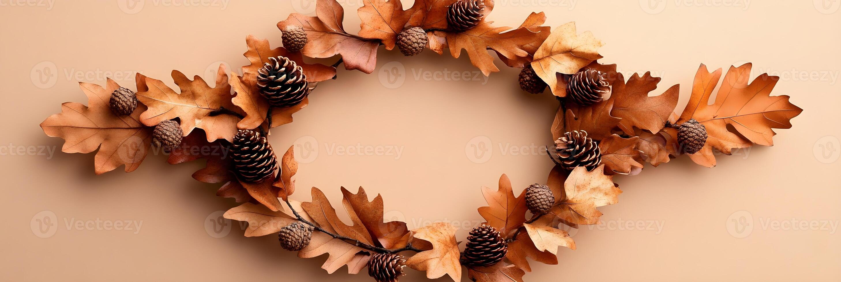 Autumn Leaves and Pine Cones Wreath on Beige Background photo