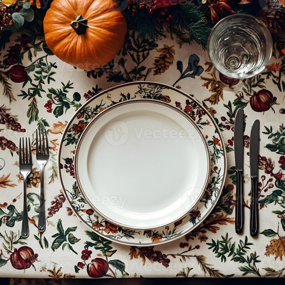 Thanksgiving Table Setting with Fall Floral Pattern Tablecloth photo