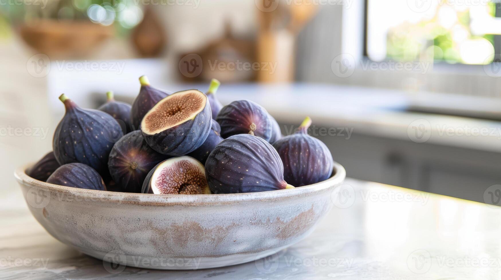 A bowl of figs on a counter photo