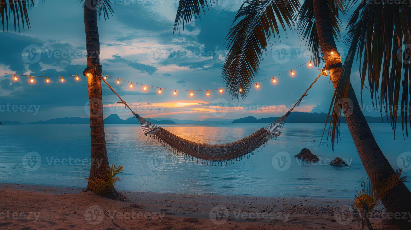 Hammock on the beach at sunset photo