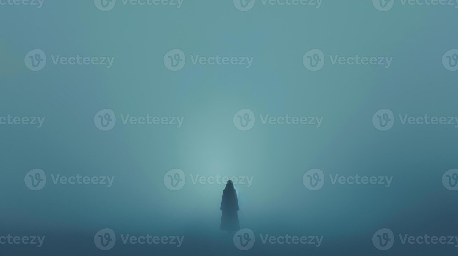 A lone person standing in the fog with a light photo