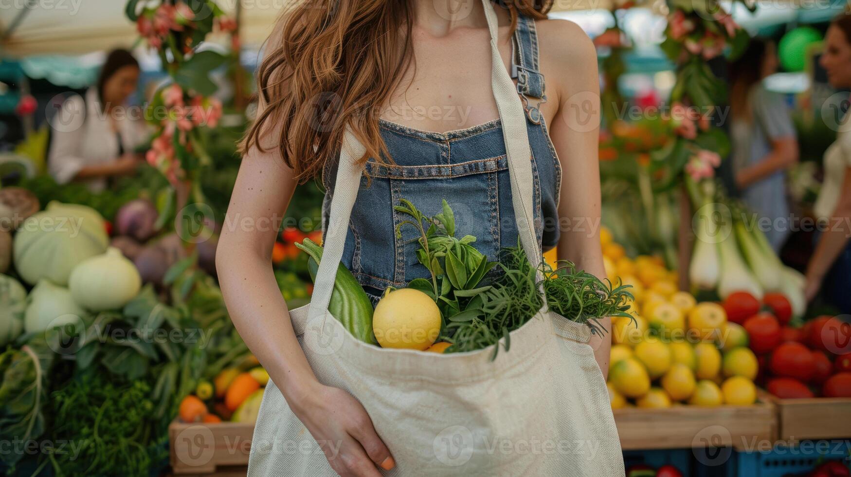 A woman holding a bag of fresh produce photo