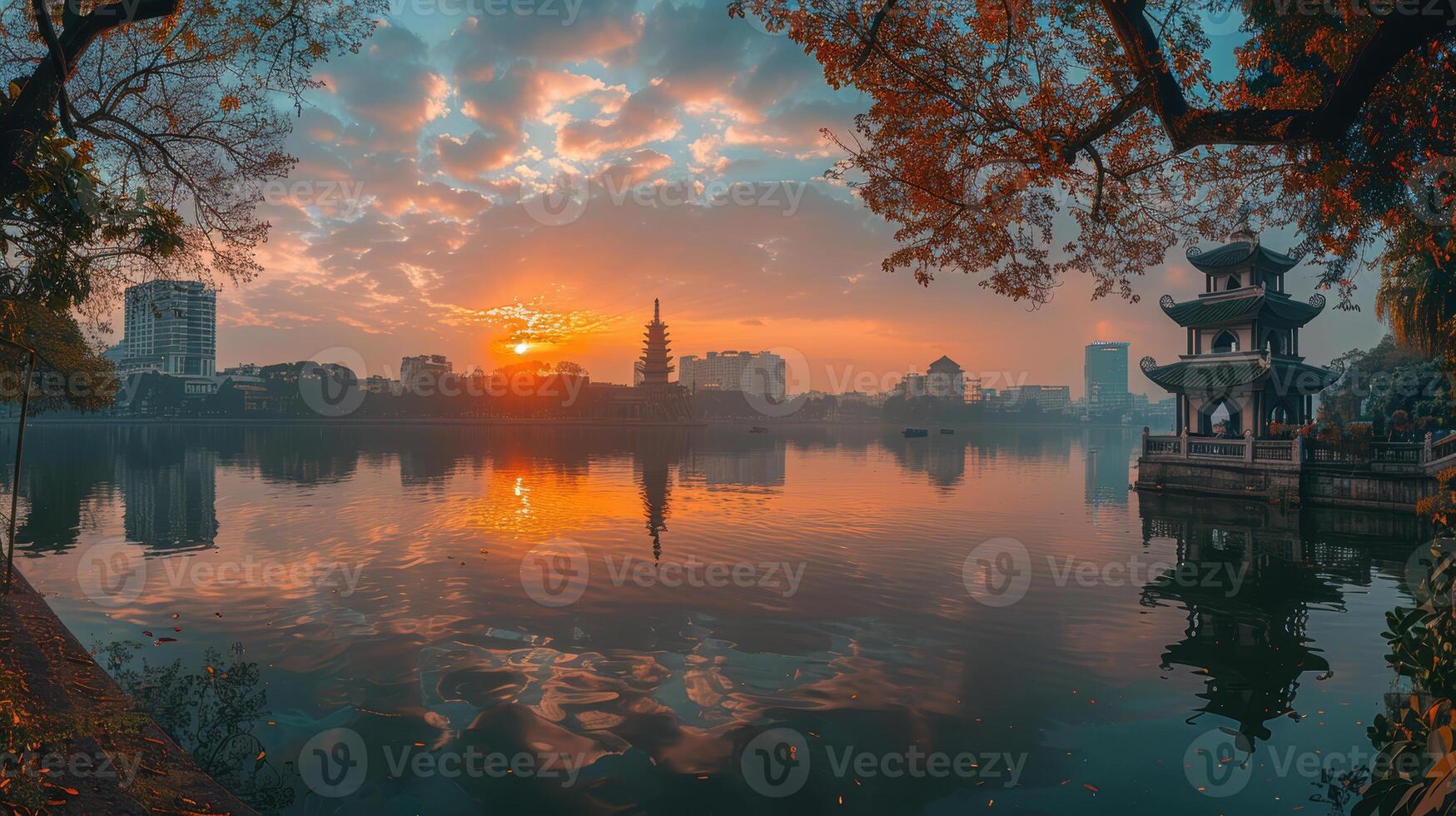 A beautiful sunset over a lake with a pagoda in the background photo
