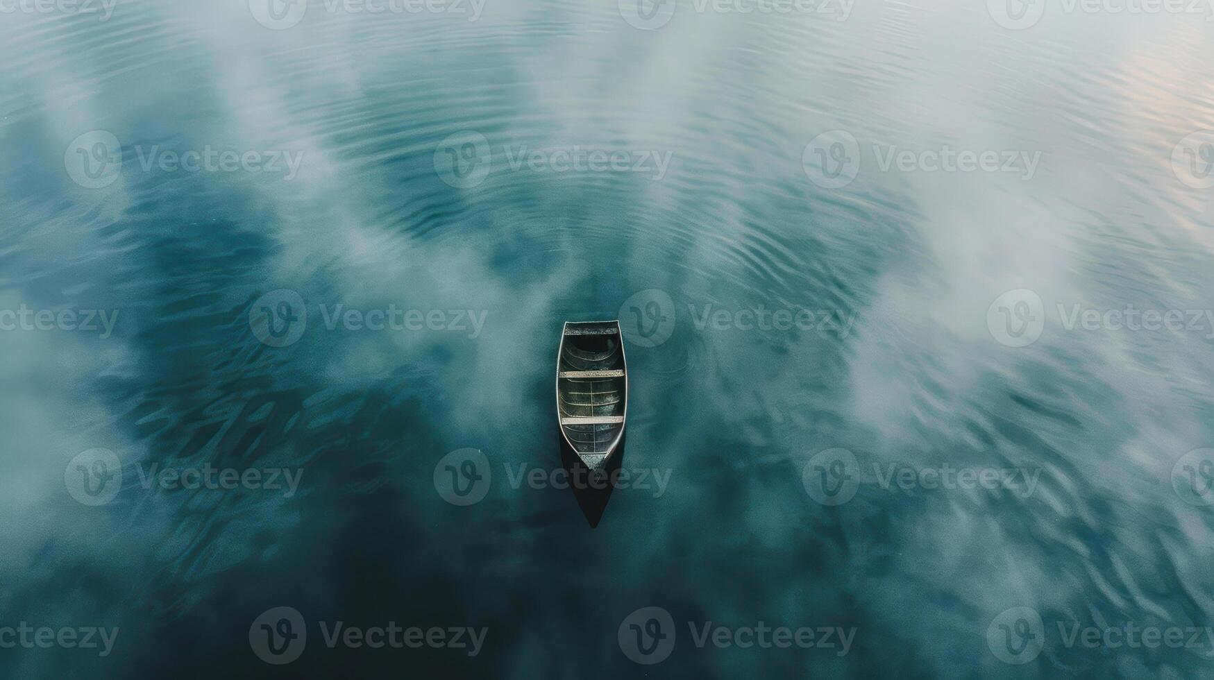 An aerial view of a boat floating in the water photo