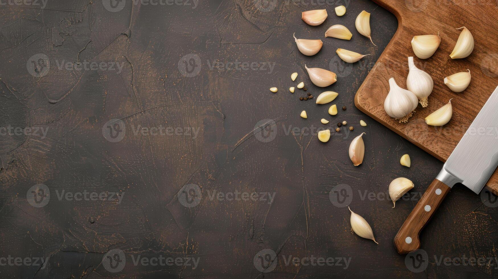 Garlic and knife on a cutting board photo