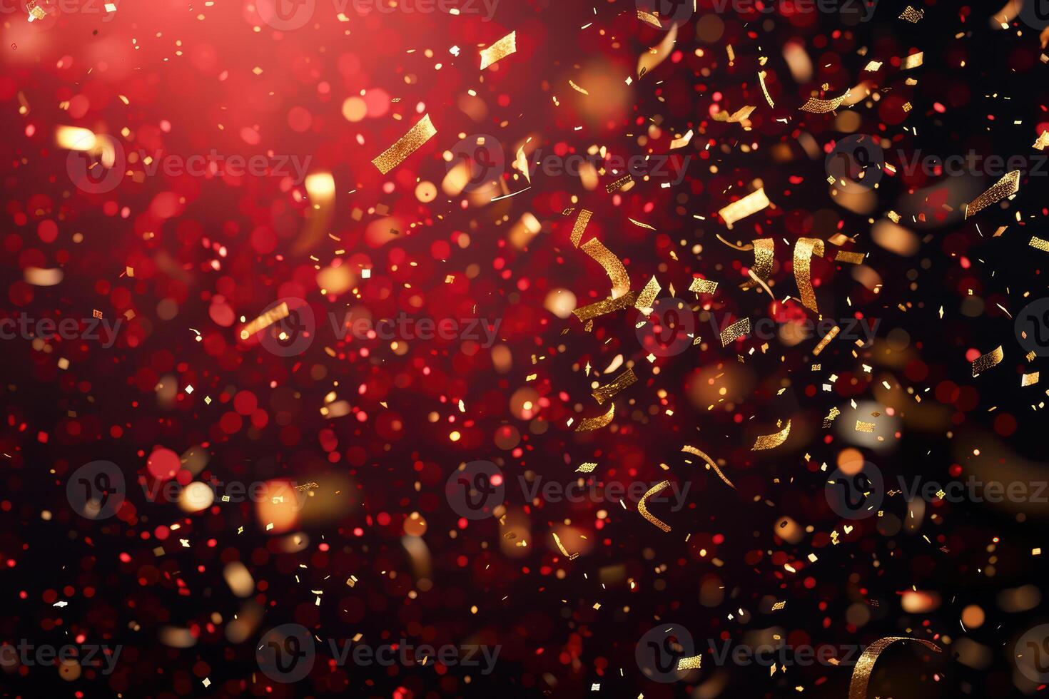Red and gold confetti falling on a black background photo