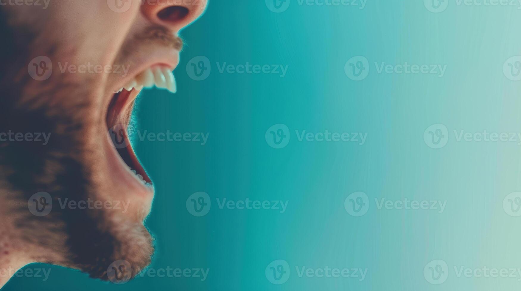 A man with his mouth open and his teeth showing photo