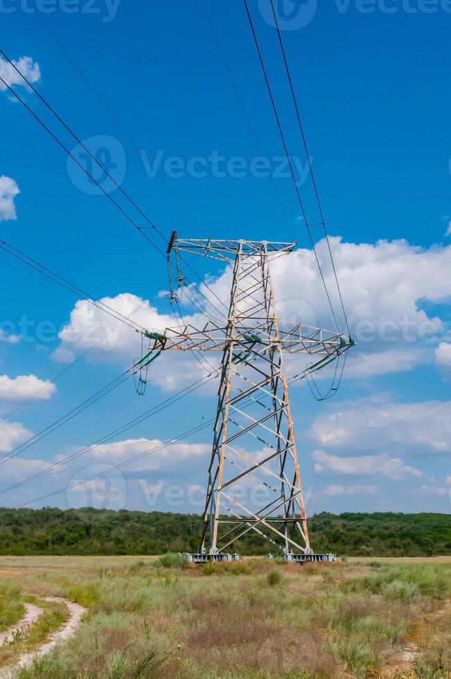 High-voltage power line against the background of the blue sky photo