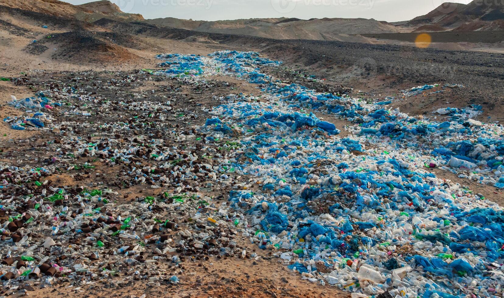 Plastic bottles and various garbage from hotels in the wild, Garbage dump in the desert in Egypt photo