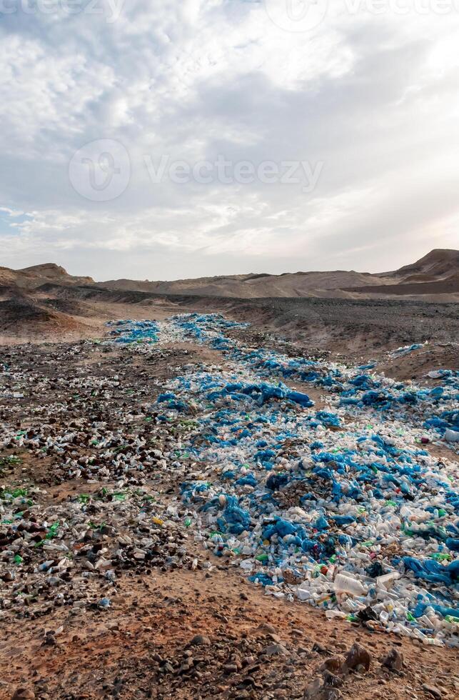 Plastic bottles and various garbage from hotels in the wild, Garbage dump in the desert in Egypt photo