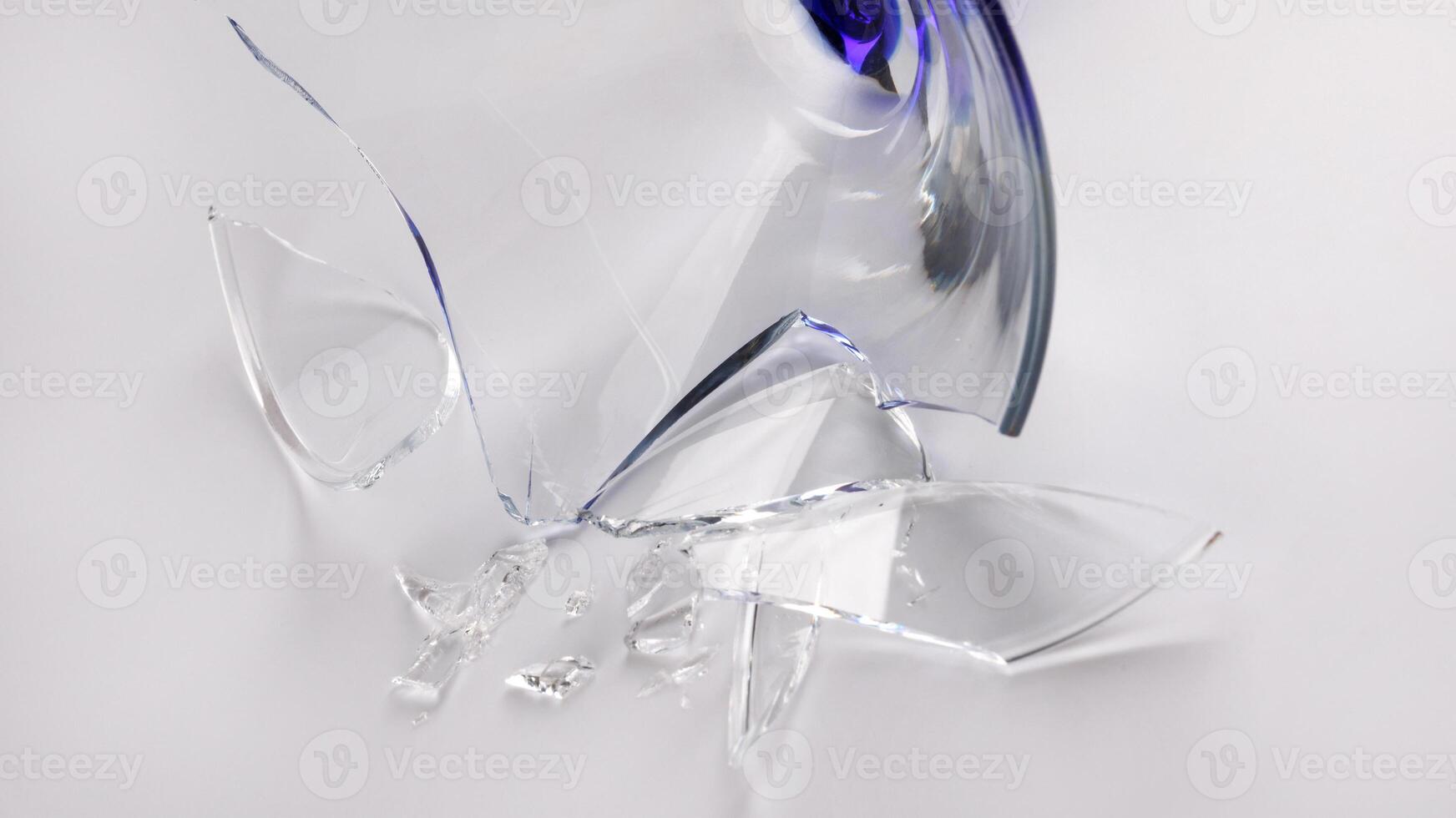 Broken wine glass on a white background. photo