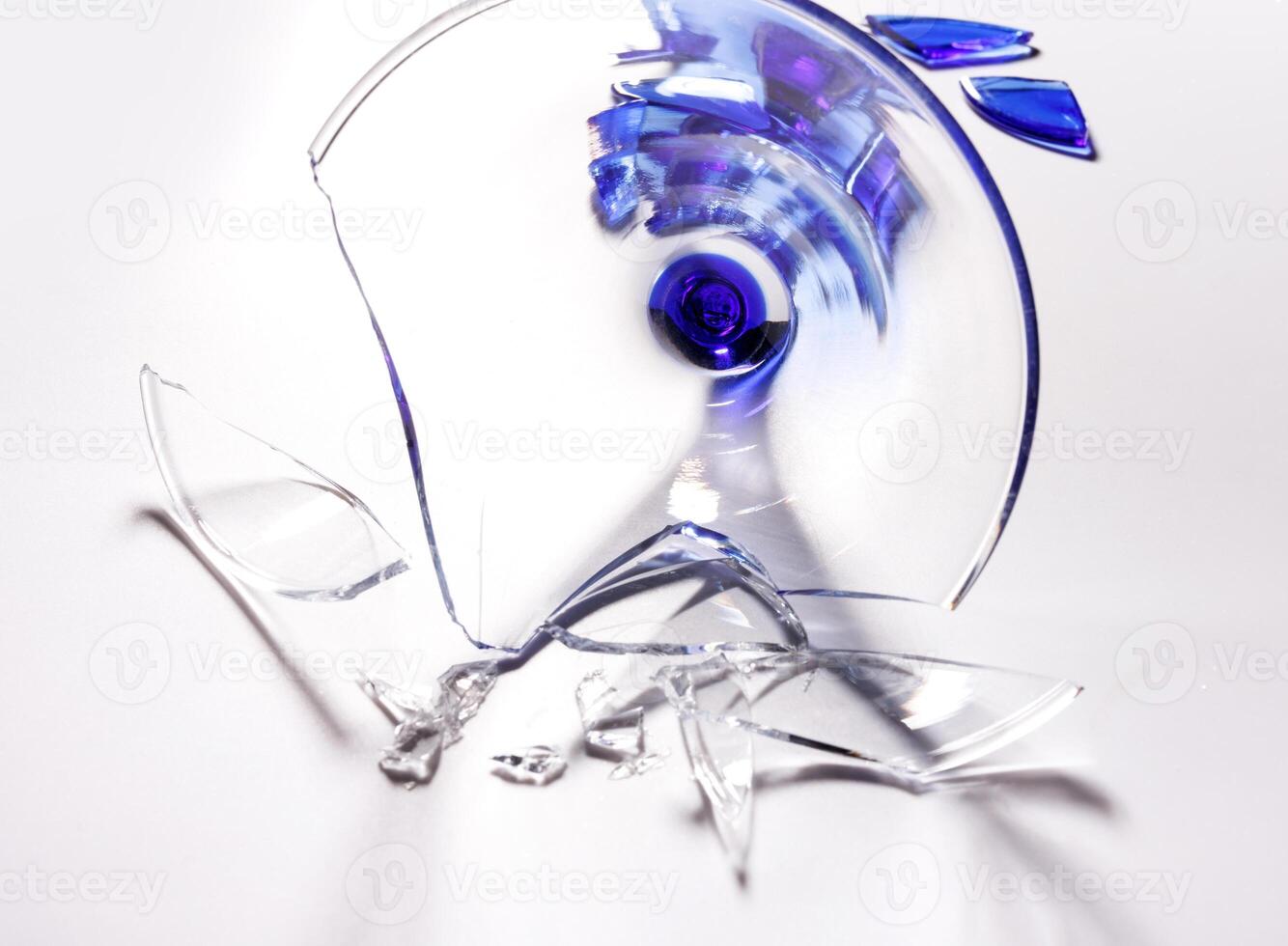 Broken wine glass on a white background. photo