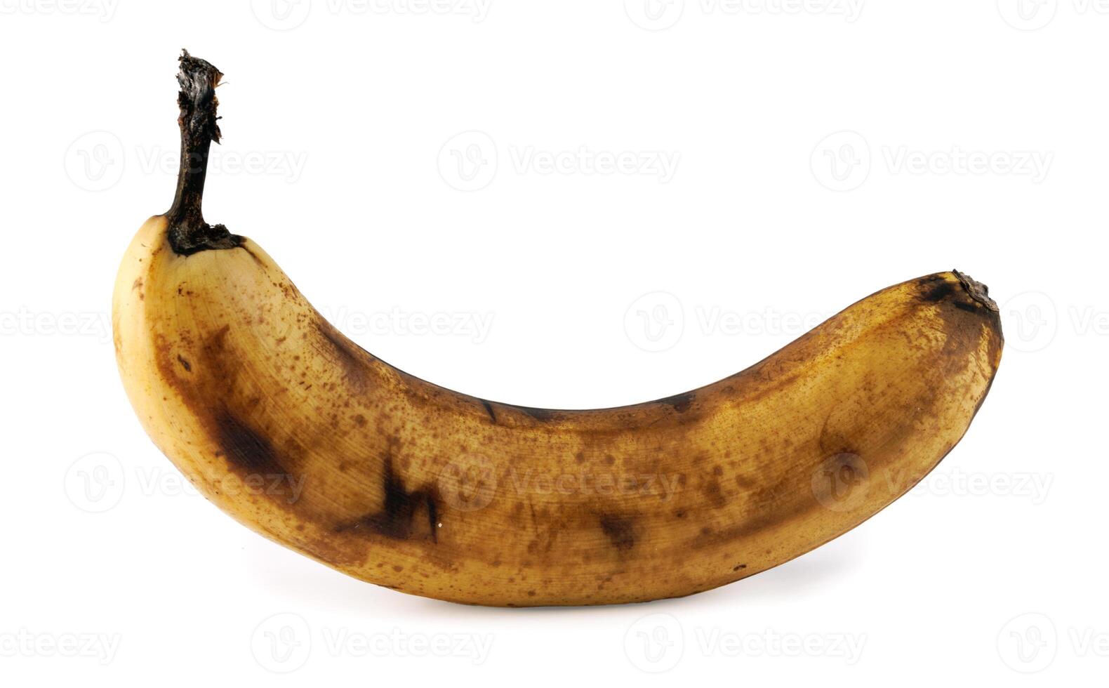 Darkened overripe banana isolated on a white background. Blackened banana peel. Spoiled banana. photo