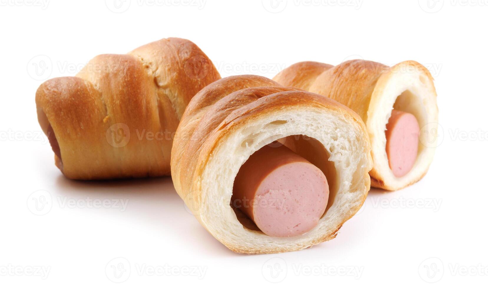 Sausages in dough cut in half isolated on a white background.Sausage in dough. photo