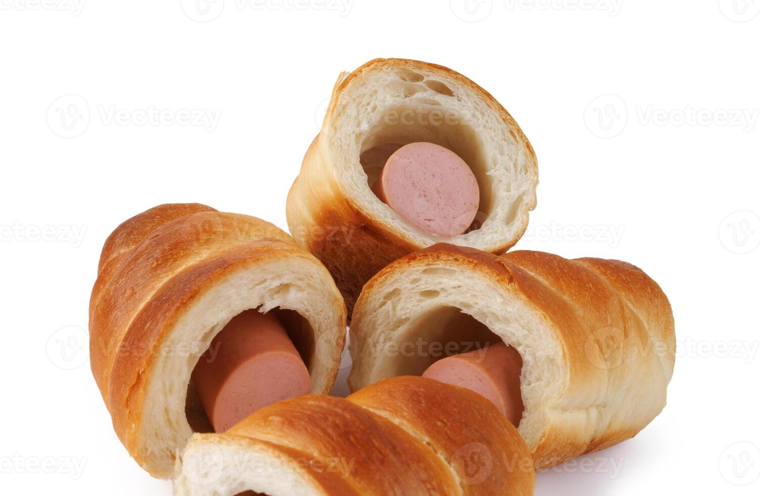 Sausages in dough cut in half isolated on a white background.Sausage in dough. photo