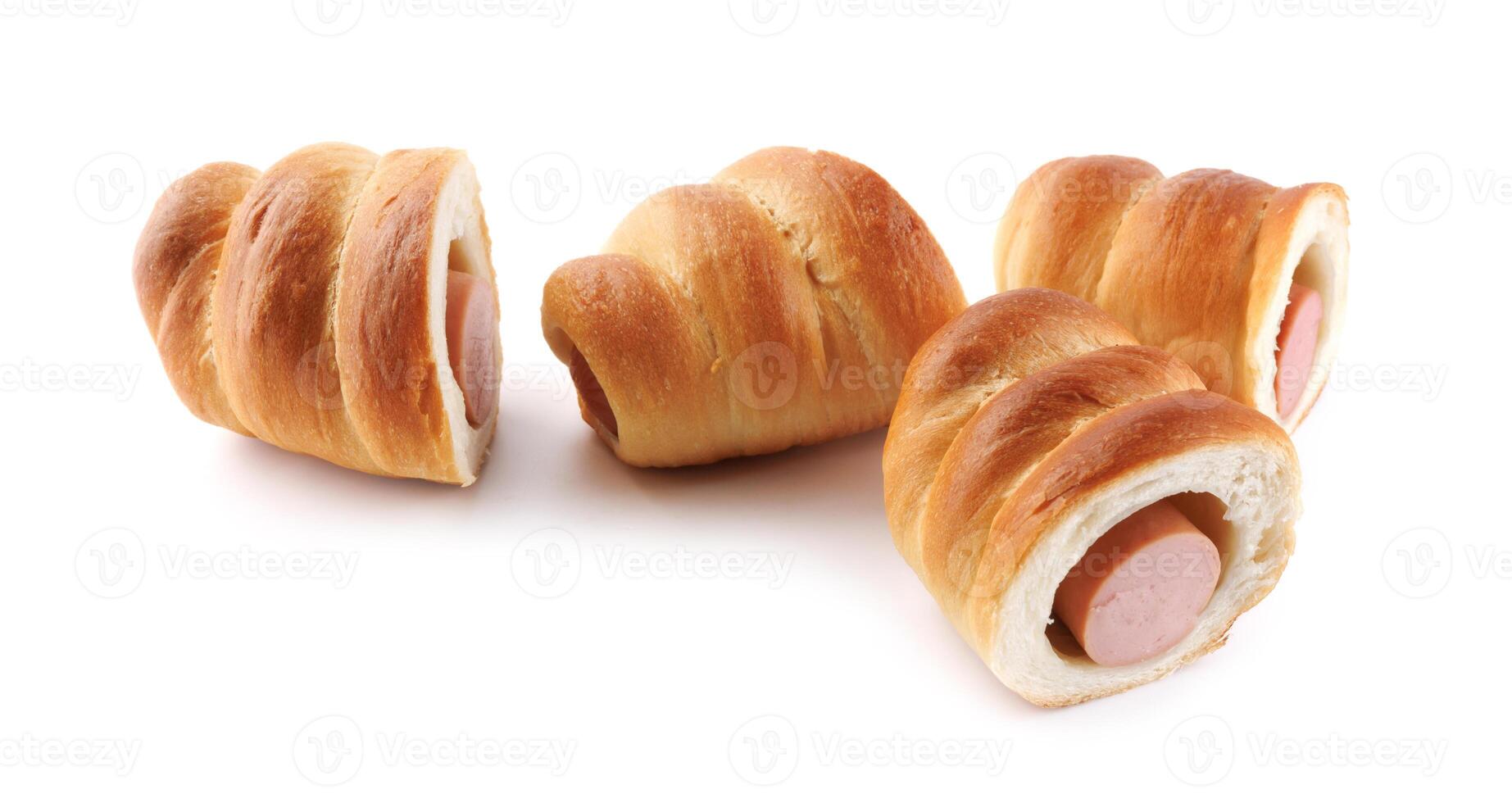 Sausages in dough cut in half isolated on a white background.Sausage in dough. photo