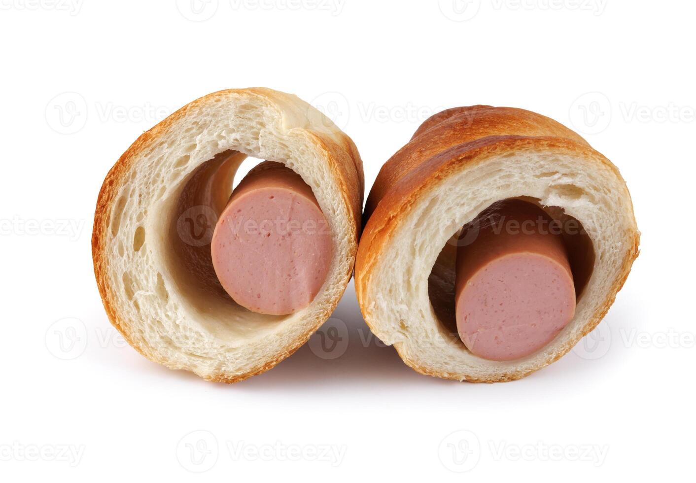 Sausage cut in half in dough isolated on a white background. photo