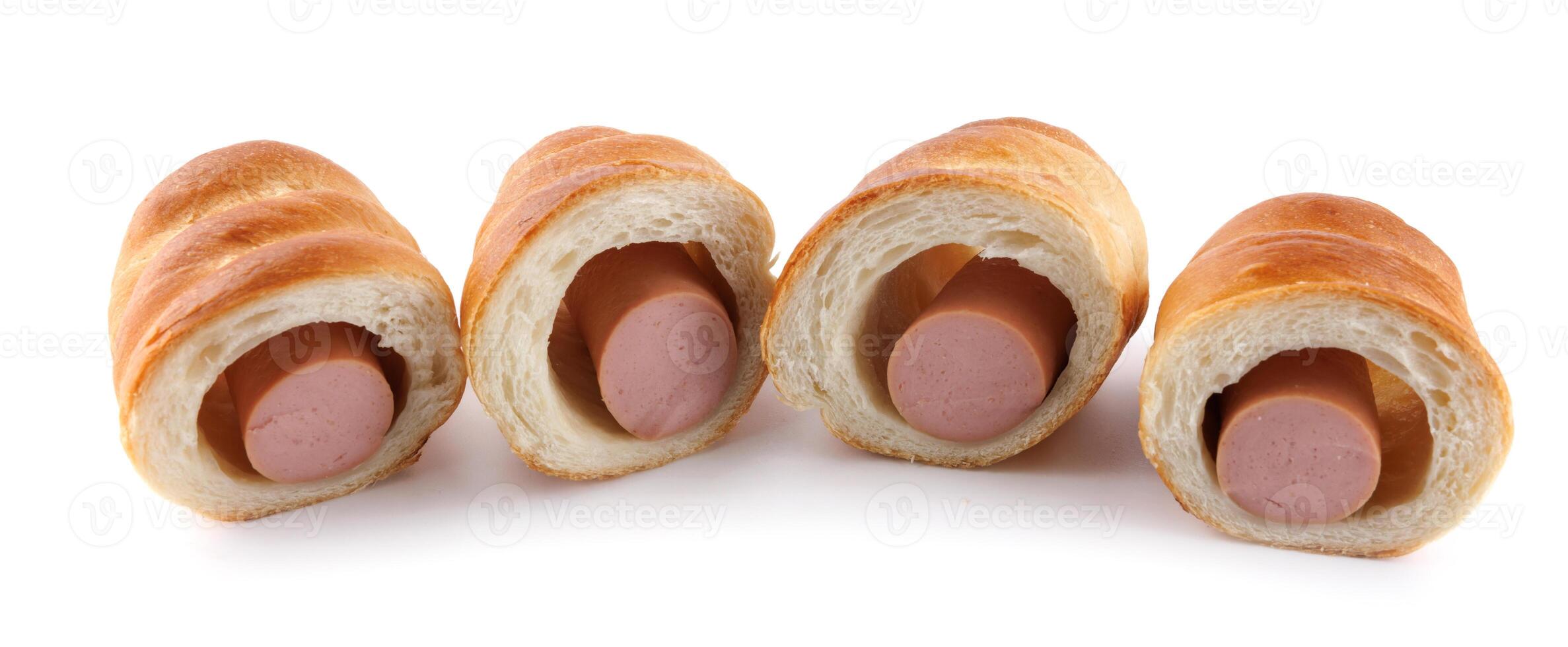 Sausages in dough cut in half isolated on a white background.Sausage in dough. photo