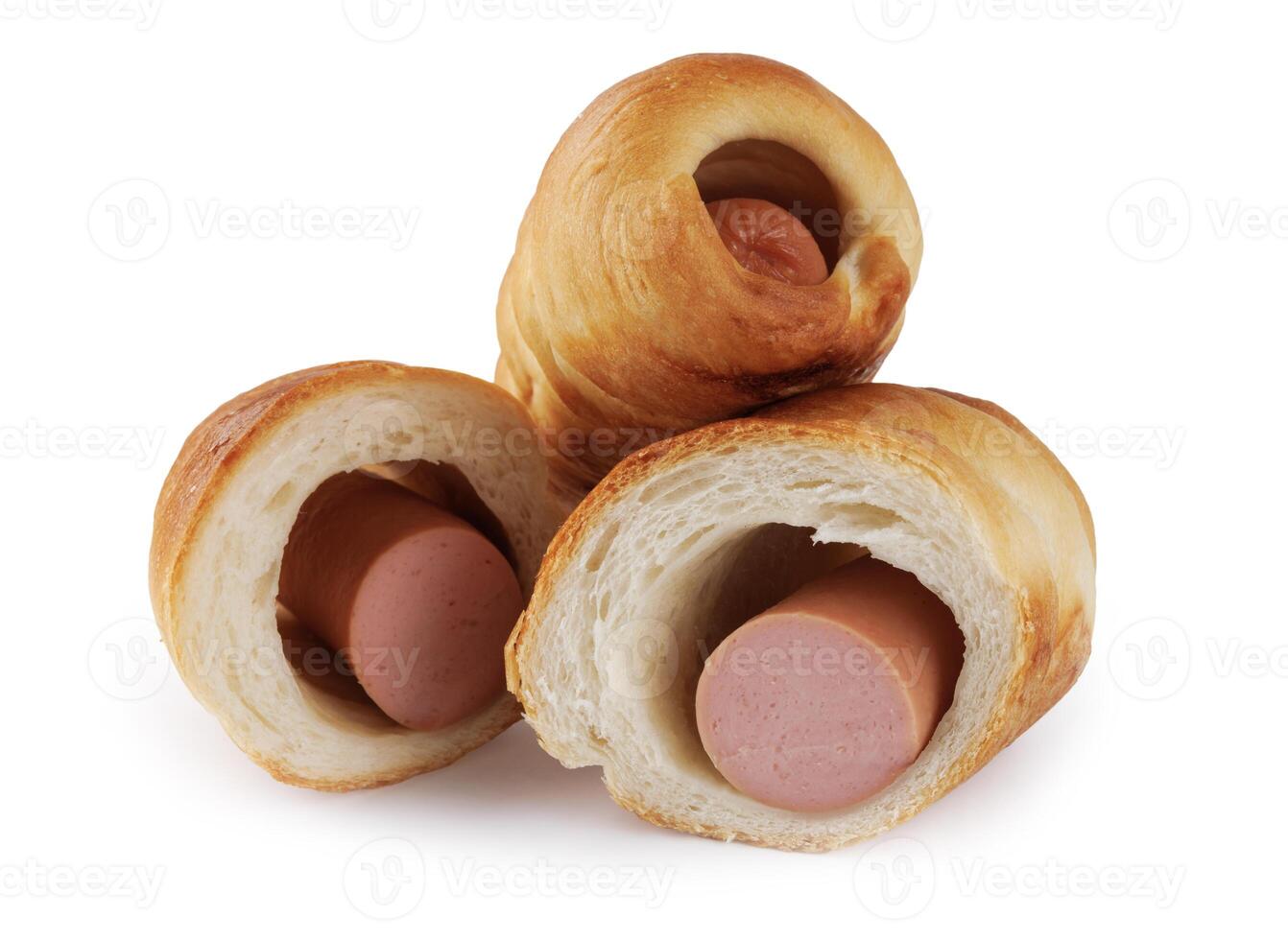 Whole and halved sausages in dough isolated on a white background. photo