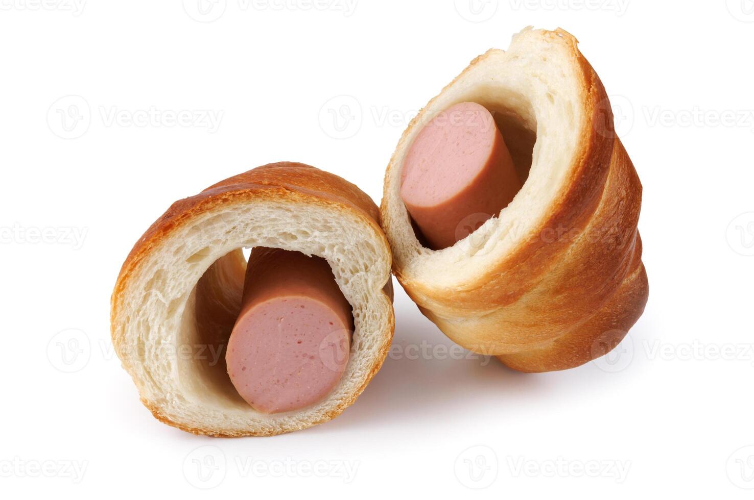 Sausage cut in half in dough isolated on a white background. photo