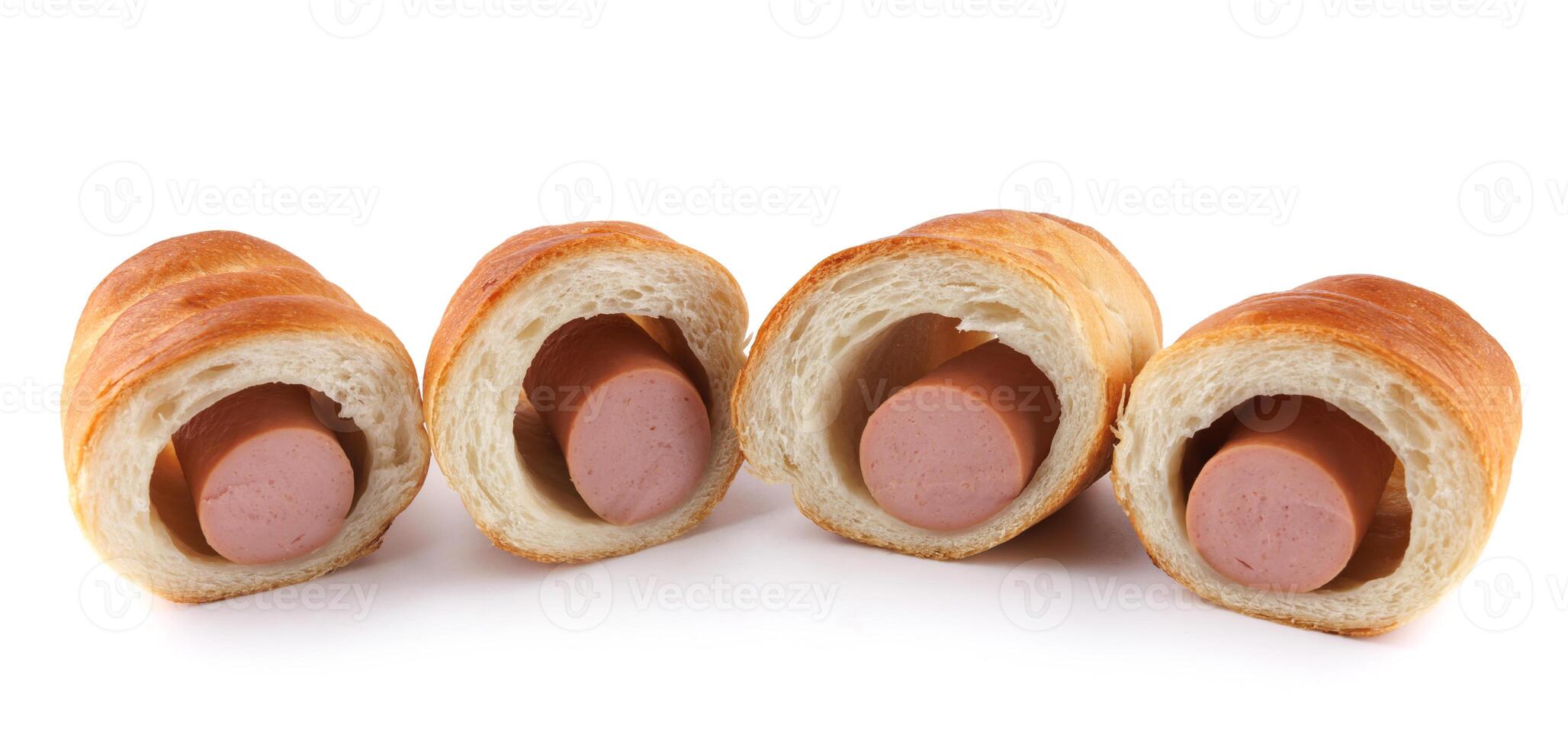 Sausages in dough cut in half isolated on a white background.Sausage in dough. photo