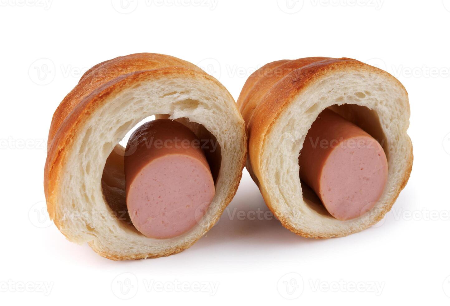 Sausage cut in half in dough isolated on a white background. photo