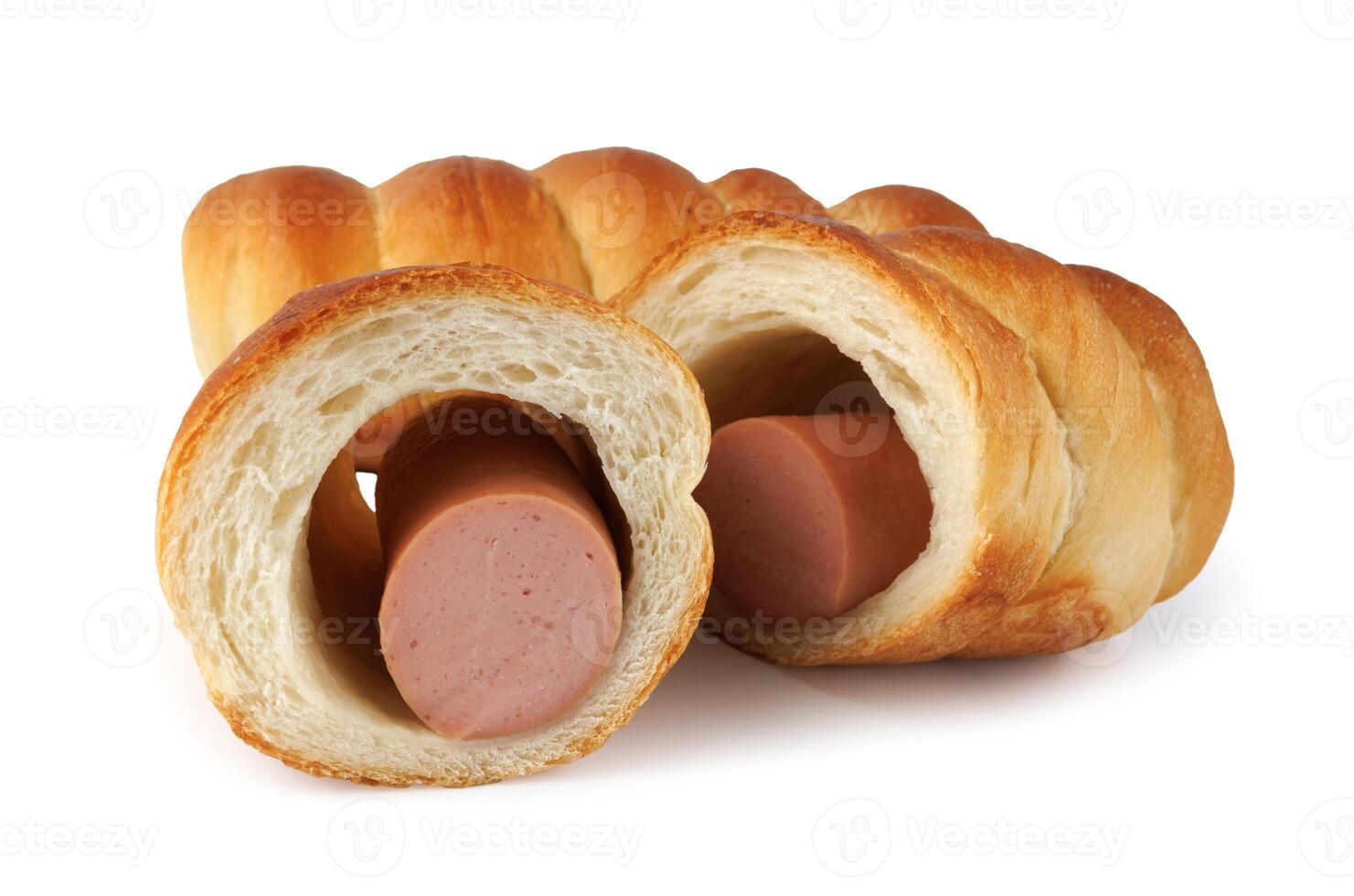 Whole and halved sausages in dough isolated on a white background. photo