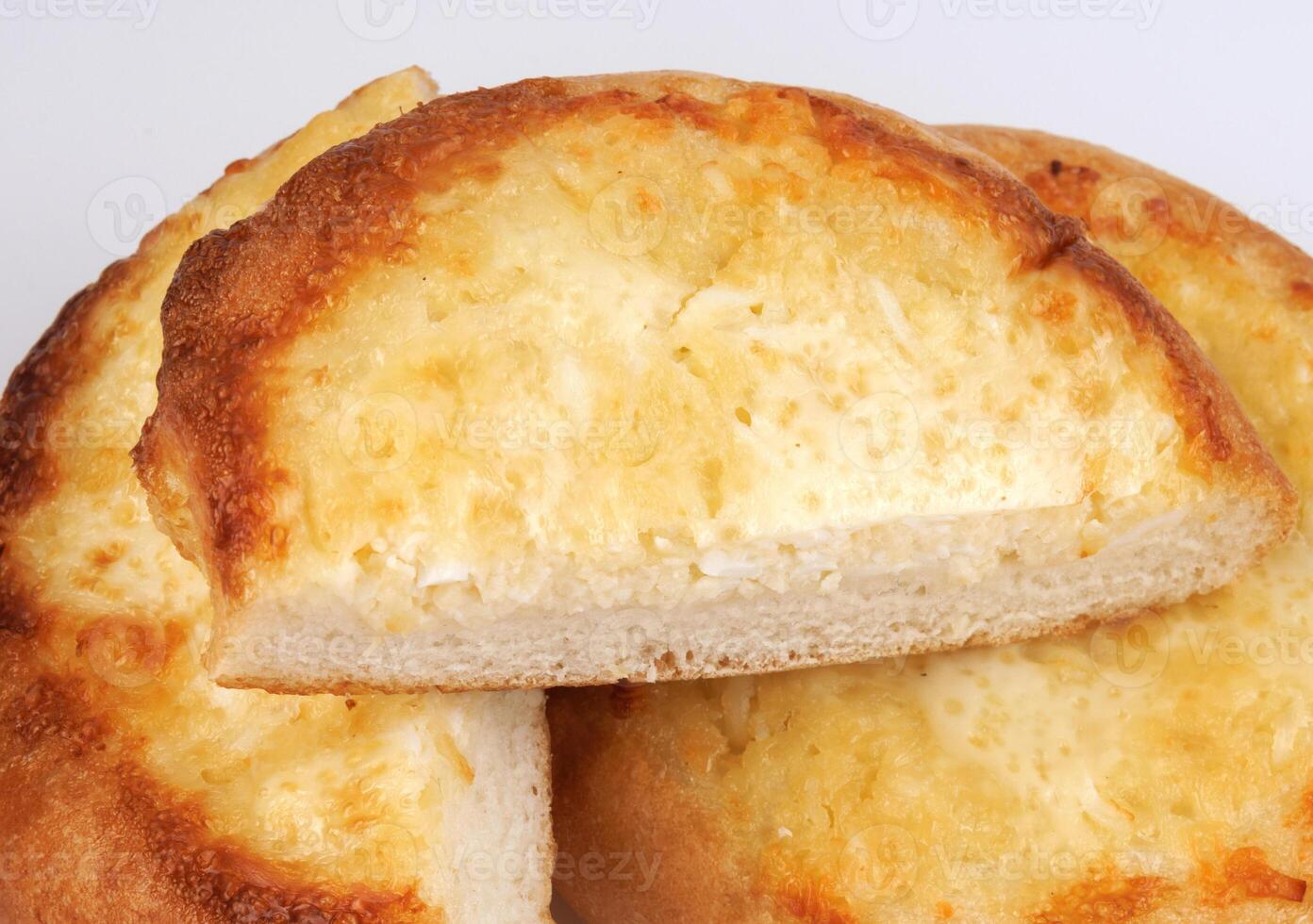 Khachapuri. Bun with cheese on a white background. Cheese pie. photo