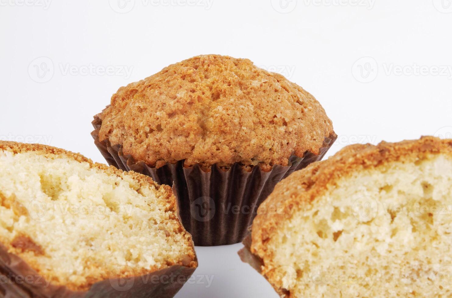 Whole and half muffin on a white background. photo