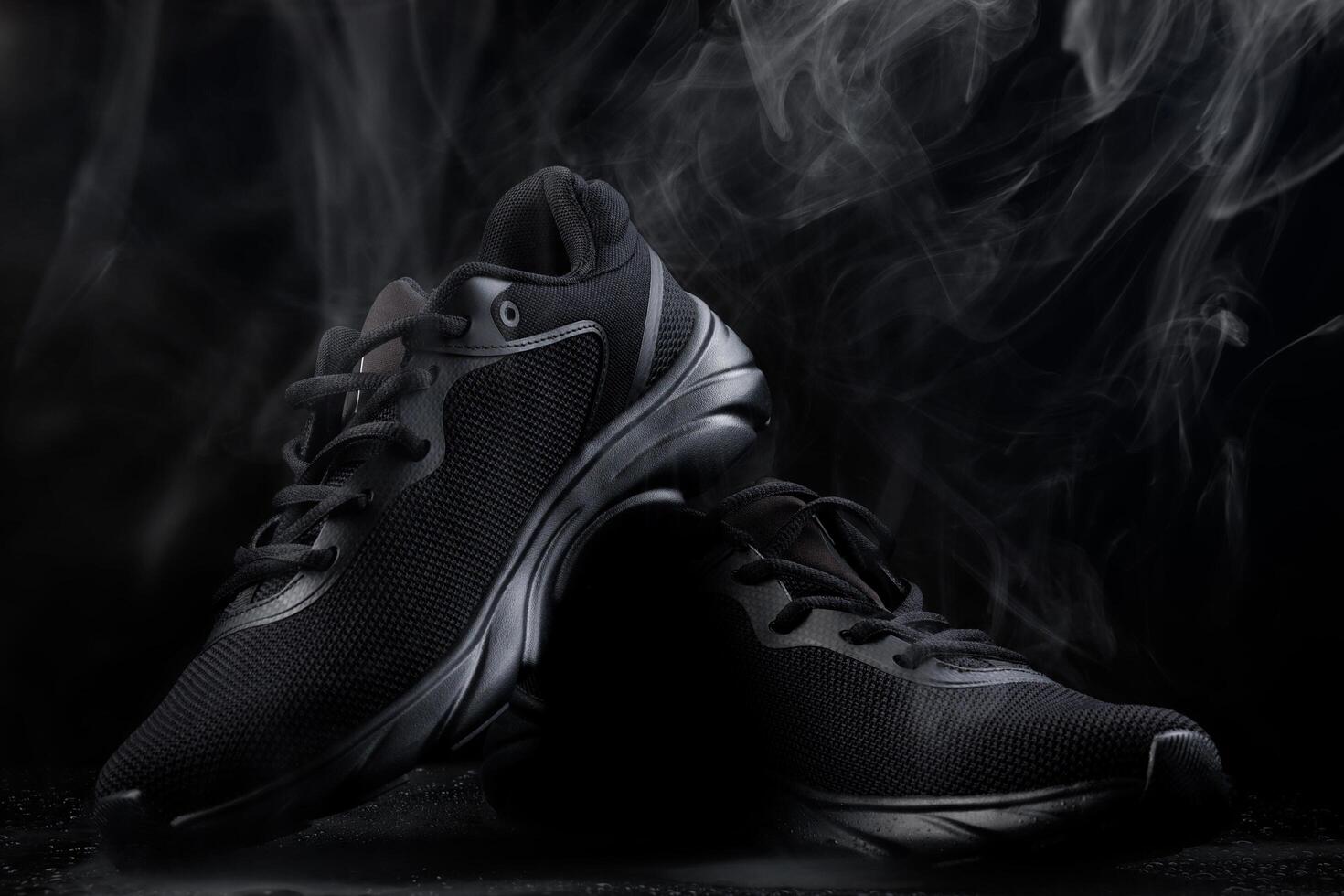 Beautiful black sneakers isolated on a white background. Sports black sneakers. photo