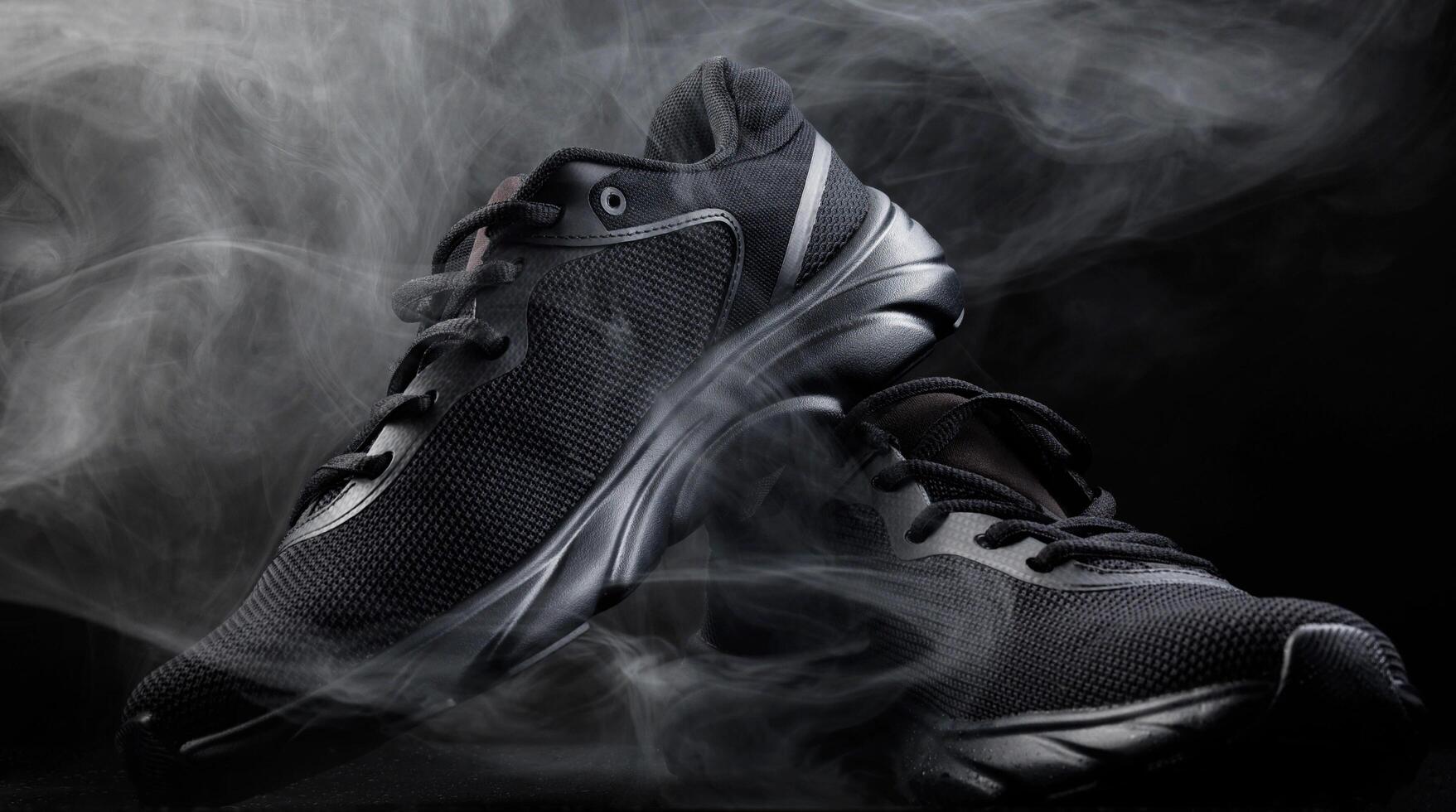 Beautiful black sneakers isolated on a white background. Sports black sneakers. photo