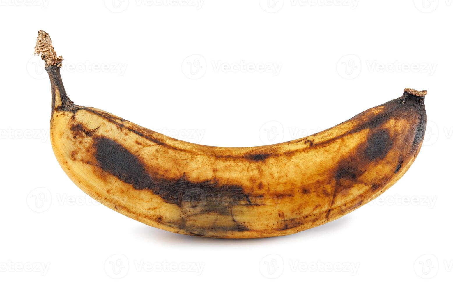 Darkened overripe bananas isolated on a white background. Blackened banana peel. Spoiled banana. photo