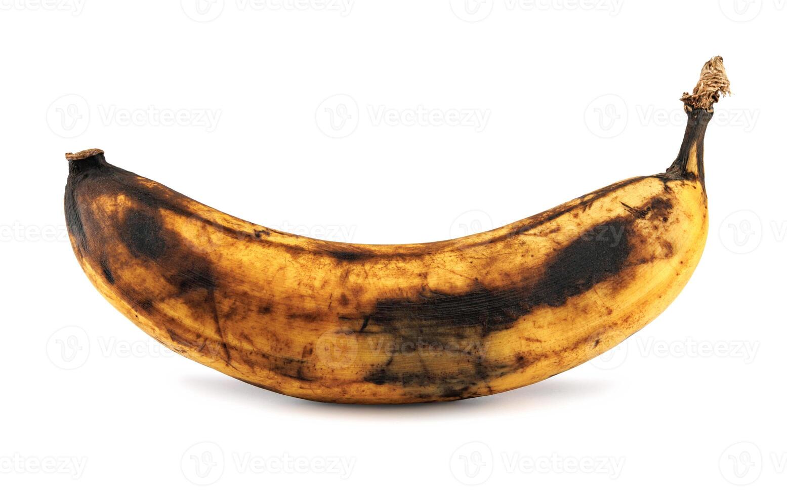 Darkened overripe bananas isolated on a white background. Blackened banana peel. Spoiled banana. photo