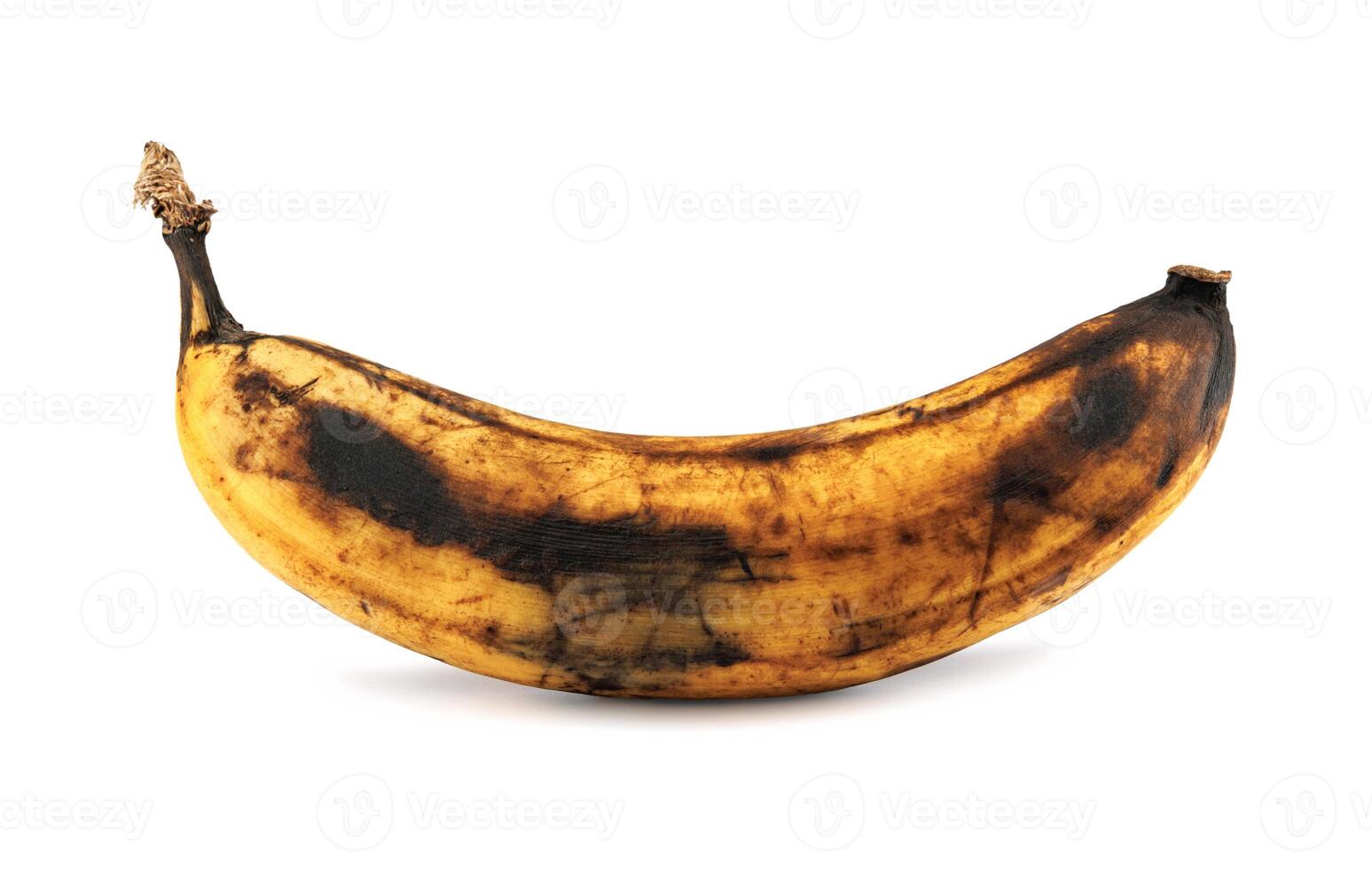 Darkened overripe bananas isolated on a white background. Blackened banana peel. Spoiled banana. photo