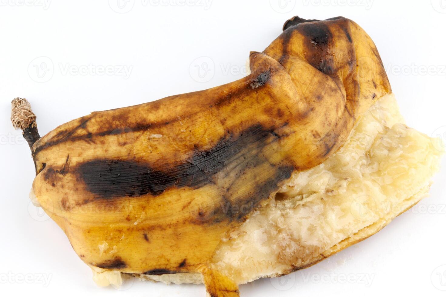 Crushed overripe banana isolated on a white background. photo