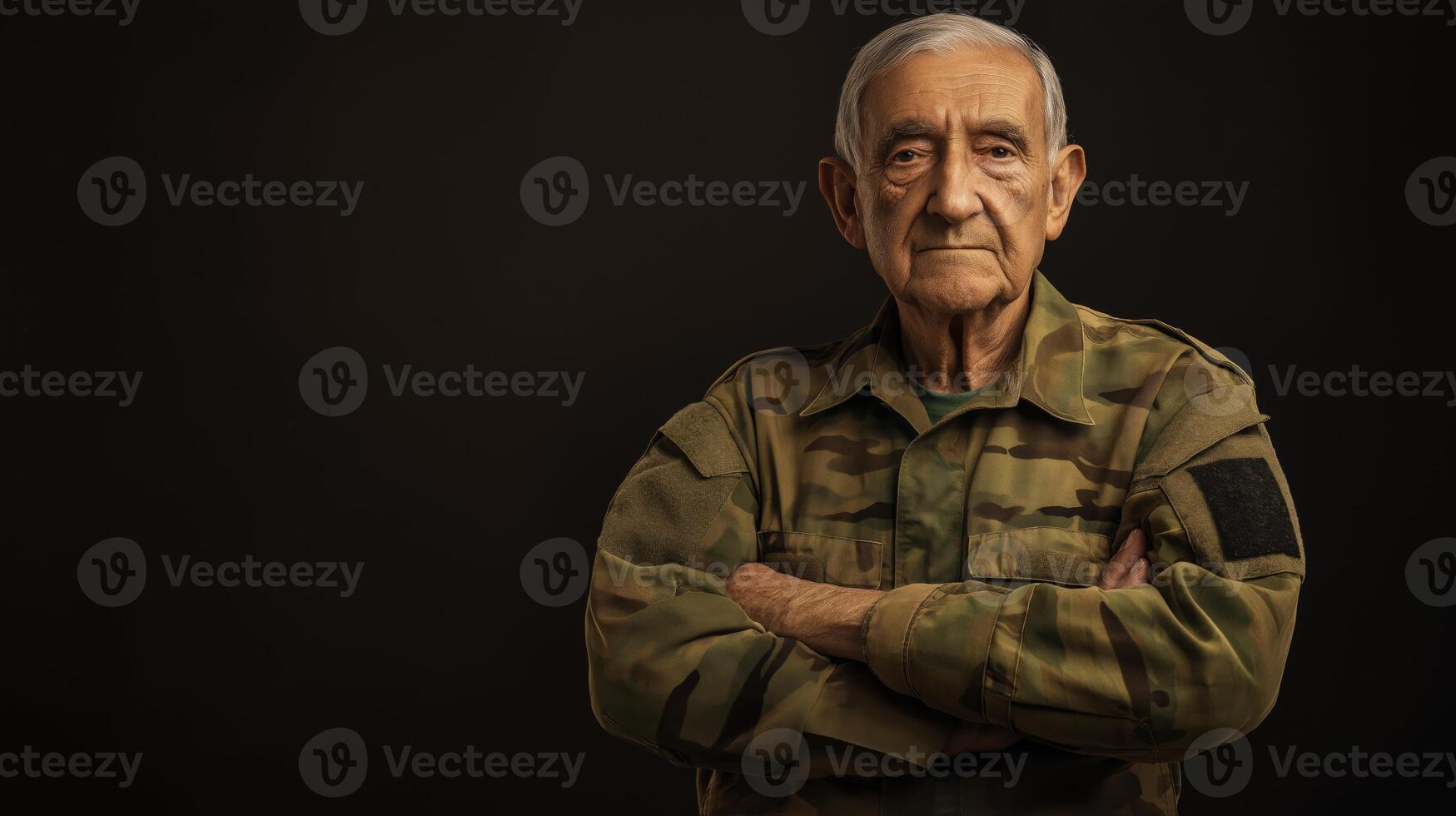 Proud Elderly Male Southern European Soldier in Camouflage Uniform Standing Against Dark Background for Military Service and Veterans Concepts photo
