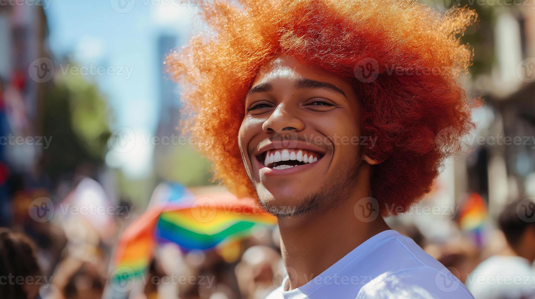 Joyful Man with Bright Red Afro Smiling at Vibrant Outdoor Celebration with Rainbow Flags photo