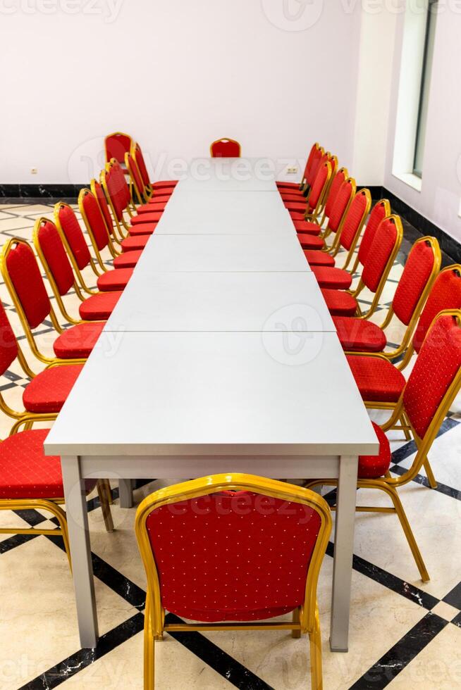 empty long table assembled from gray wooden tables photo