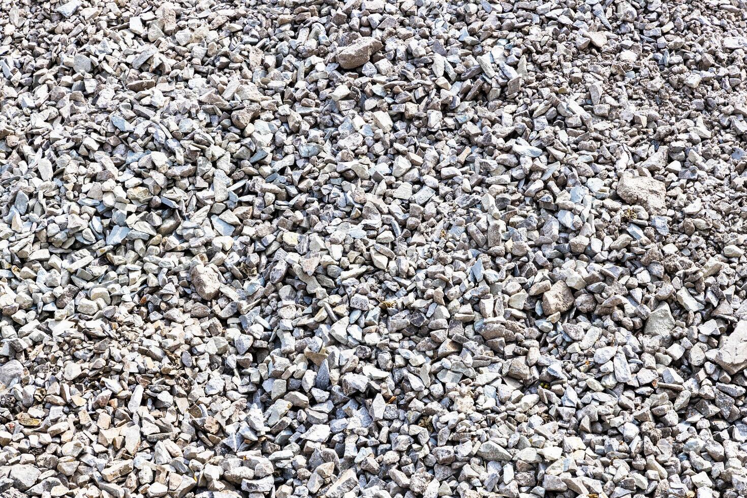 background from gray crushed stone on road surface photo