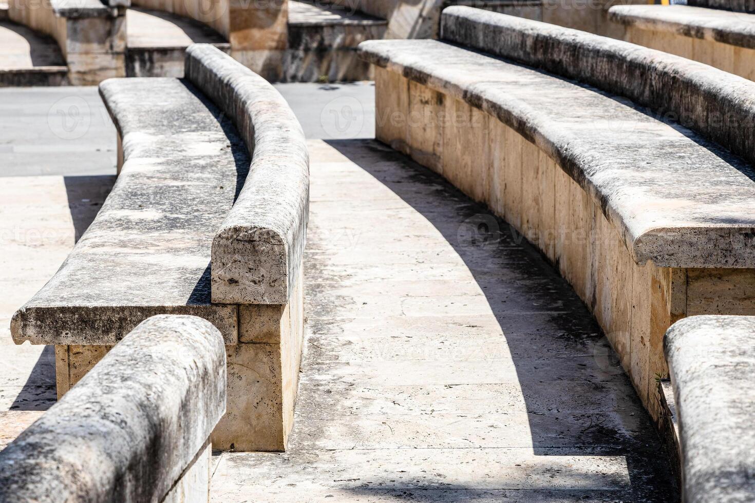 stone benches in outdoor amphitheatre close up photo