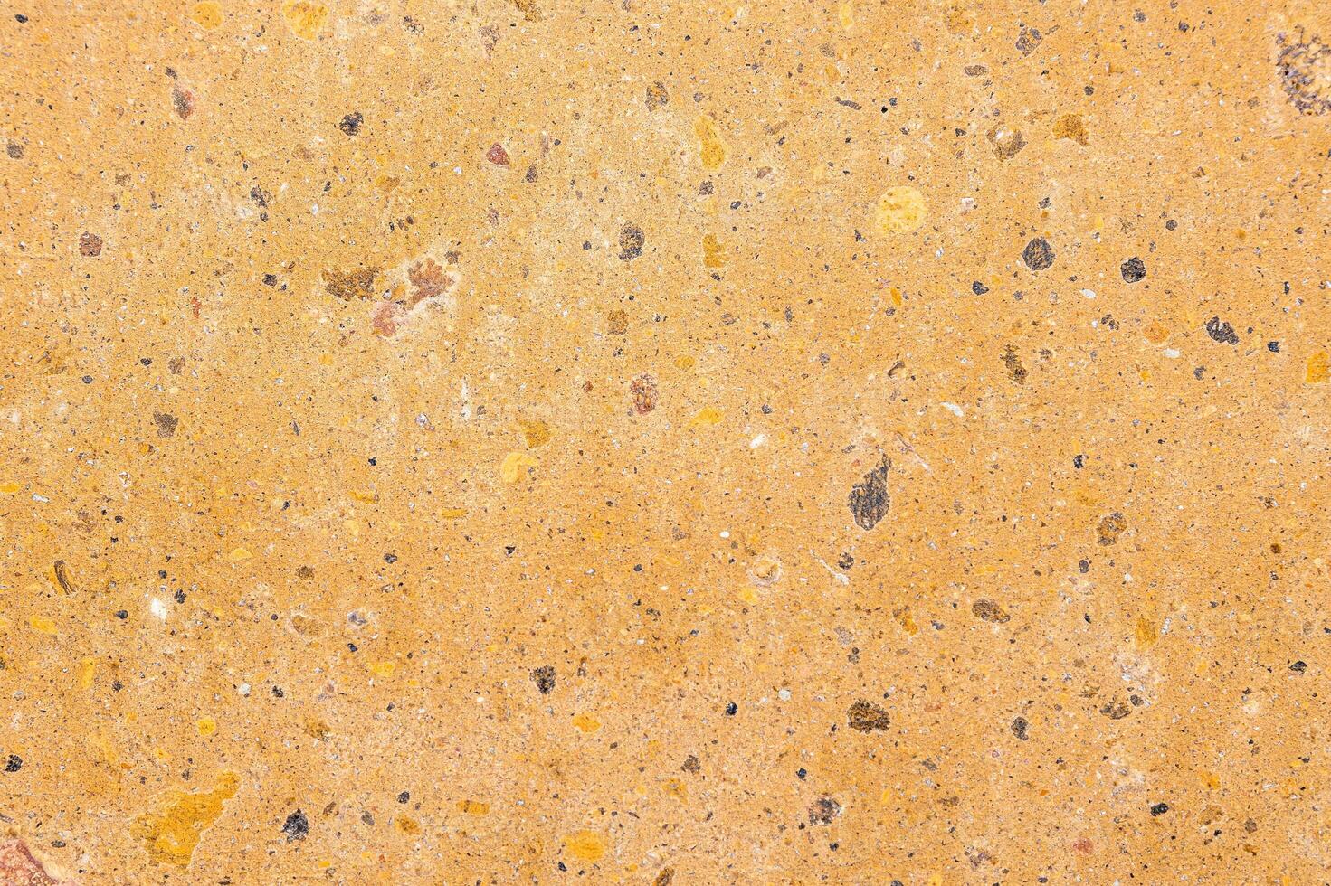 armenian dark yellow tuff surface on wall photo