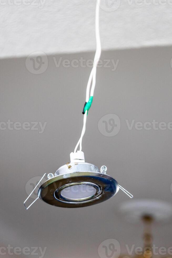 repairing built-in ceiling light at home photo