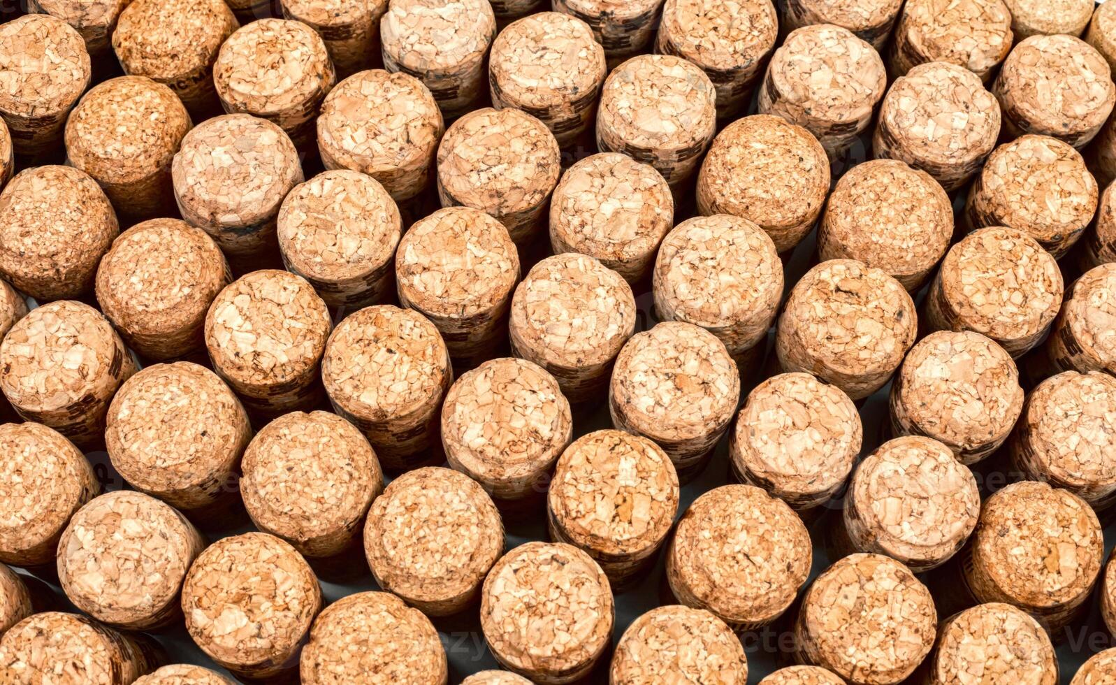 Background from textured wine corks, top view. place for text photo