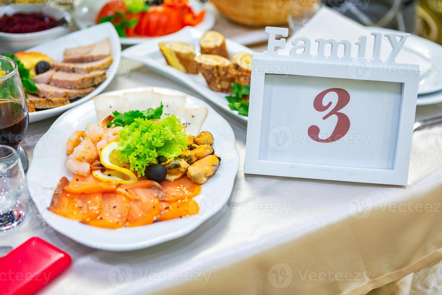 Family Table Setup With Seafood Platter and Elegant Decor at a Celebration Gathering. photo