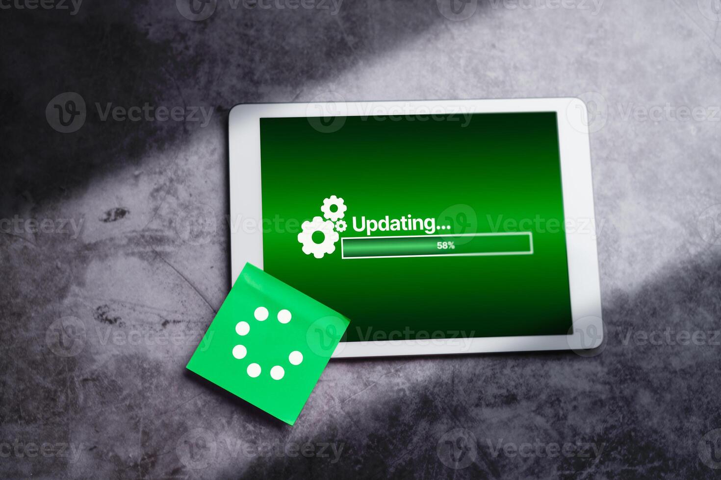 Top view of digital tablet with updating software on screen. System engineer and programming. Software apps developer. photo