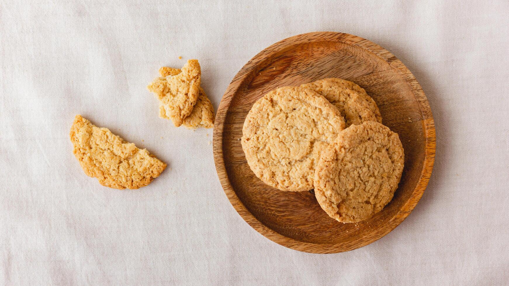 Oatmeal cookies on a wooden plate photo