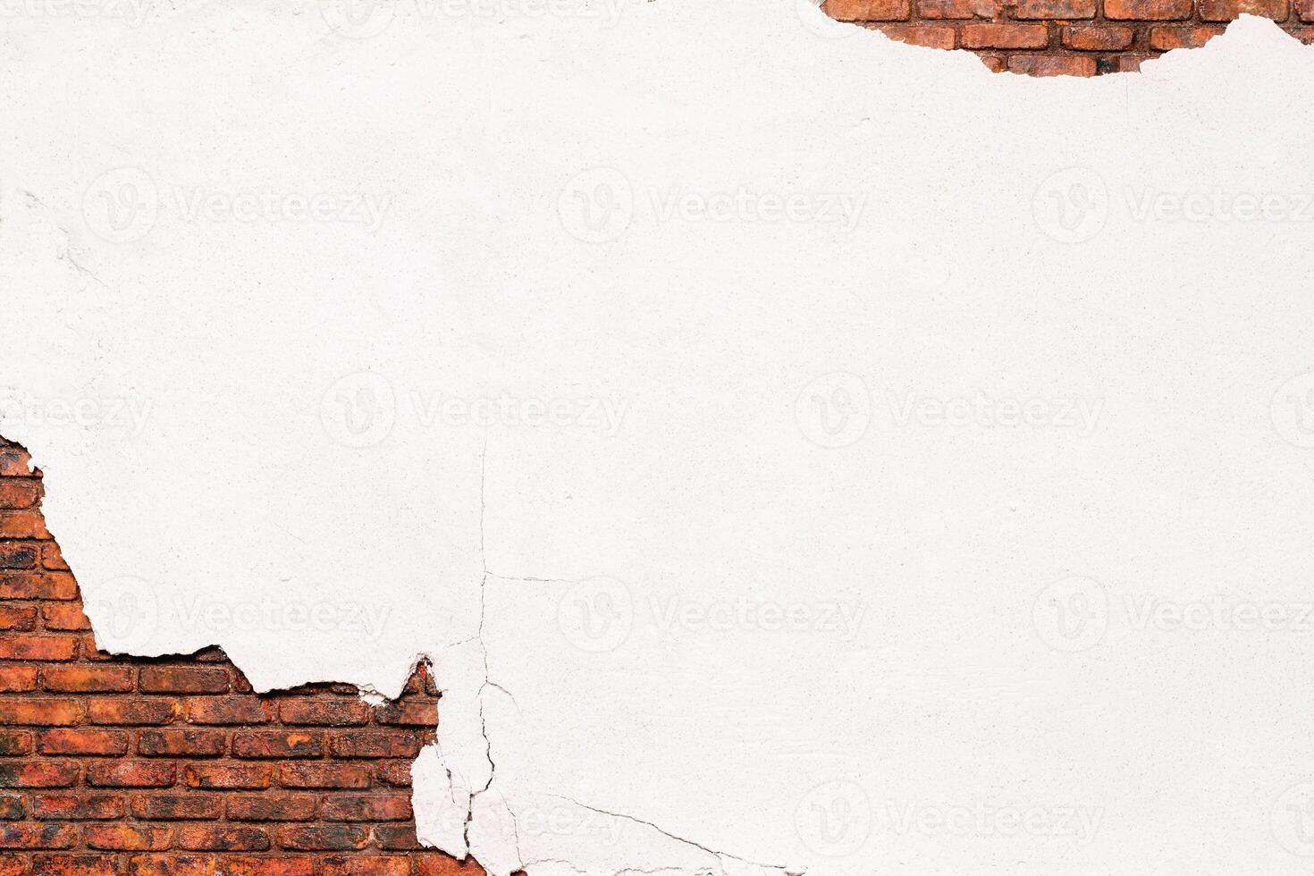 old crumbling white plaster, texture of peeling putty from a brick wall photo